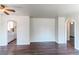 Bright living room featuring dark hardwood floors and open doorways at 3311 S Eudora St, Denver, CO 80222