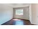 Bright living area featuring hardwood floors and a large window at 3311 S Eudora St, Denver, CO 80222