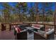 Relax on the deck, with comfortable seating and string lights, perfect for outdoor entertaining at 36920 Forest Trl, Elizabeth, CO 80107