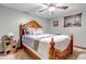 Comfortable bedroom with a decorative headboard and light gray walls at 36920 Forest Trl, Elizabeth, CO 80107