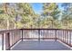 Spacious wooden deck overlooking a forest, perfect for enjoying nature at 36920 Forest Trl, Elizabeth, CO 80107