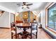 Bright dining room with wood floors and trim located near the living room at 36920 Forest Trl, Elizabeth, CO 80107