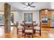 Inviting dining room with wood accents, open to kitchen, and stone pillar at 36920 Forest Trl, Elizabeth, CO 80107