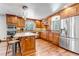 Spacious kitchen featuring custom wood cabinetry, granite countertops, stainless steel appliances, and a central island at 36920 Forest Trl, Elizabeth, CO 80107