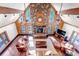 Living room with vaulted ceiling and stone fireplace, perfect for relaxing with Gathering at 36920 Forest Trl, Elizabeth, CO 80107