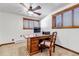 Functional home office with wood desk, chair, and natural light at 36920 Forest Trl, Elizabeth, CO 80107