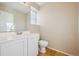 Small bathroom with white vanity and toilet at 10219 Vine Ct, Thornton, CO 80229