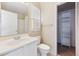 Bathroom with vanity, toilet and linen closet at 10219 Vine Ct, Thornton, CO 80229