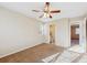 Spacious bedroom with ceiling fan and en-suite bathroom at 10219 Vine Ct, Thornton, CO 80229