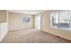 Spacious dining area with carpet and sliding glass doors at 10219 Vine Ct, Thornton, CO 80229