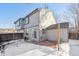 Exterior view of the home with snow covered yard at 10219 Vine Ct, Thornton, CO 80229