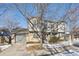 Two-story townhome with stone accents and attached garage at 10219 Vine Ct, Thornton, CO 80229