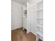 Spacious walk-in closet with shelving and drawers at 10219 Vine Ct, Thornton, CO 80229