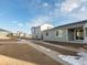 House exterior showcasing gray siding and landscaping at 17355 E 91St Pl, Commerce City, CO 80022