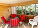 Sunroom with table, chairs, and ample natural light at 3001 Pontiac St, Denver, CO 80207