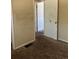 Neutral-toned bedroom with patterned brown carpet and an open door frame at 804 S 1St Ave, Brighton, CO 80601