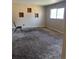 Bedroom with brown carpet, a window, a bare chair, and empty squares on the wall, ready for personalization at 804 S 1St Ave, Brighton, CO 80601