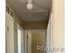 Hallway with neutral walls and door frames leading to other rooms in the home at 804 S 1St Ave, Brighton, CO 80601