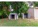 Backyard featuring sheds, and plenty of shade trees and a large grassy space at 5635 Nebraska Way, Denver, CO 80224