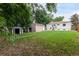 Spacious backyard with mature trees and two storage sheds at 5635 Nebraska Way, Denver, CO 80224