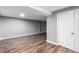 View of basement showcasing new vinyl flooring, neutral paint color and a spacious layout at 5635 Nebraska Way, Denver, CO 80224