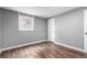 Bedroom with laminate floors, natural light, and gray painted walls at 5635 Nebraska Way, Denver, CO 80224