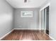 Cozy bedroom with ceiling fan, mirrored closet and light from the window at 5635 Nebraska Way, Denver, CO 80224