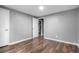 Bedroom featuring hardwood floors, a ceiling fan, and gray walls at 5635 Nebraska Way, Denver, CO 80224