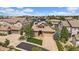 Aerial view of a suburban neighborhood showcasing a house with a well-maintained yard at 10632 Star Thistle Ct, Highlands Ranch, CO 80126