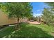 Backyard with artificial turf, a brick patio, and a well-manicured lawn perfect for outdoor relaxation at 10632 Star Thistle Ct, Highlands Ranch, CO 80126