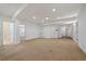 Spacious carpeted basement with white walls and recessed lighting at 10632 Star Thistle Ct, Highlands Ranch, CO 80126