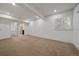 Large room featuring neutral walls, carpet floors, and a window with white shutters at 10632 Star Thistle Ct, Highlands Ranch, CO 80126