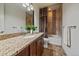 Bathroom features a stylish vanity with granite countertops, a tiled shower and bath combo at 10632 Star Thistle Ct, Highlands Ranch, CO 80126