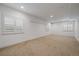 Bright carpeted room with white walls and shuttered windows at 10632 Star Thistle Ct, Highlands Ranch, CO 80126