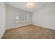 Bright bedroom with neutral walls, carpet floors, and a window with white shutters at 10632 Star Thistle Ct, Highlands Ranch, CO 80126