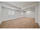 Spacious room with neutral walls, carpet floors, and a window with white shutters at 10632 Star Thistle Ct, Highlands Ranch, CO 80126