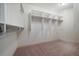 Spacious walk-in closet featuring custom shelving and ample storage for clothes and accessories at 10632 Star Thistle Ct, Highlands Ranch, CO 80126