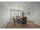 Formal dining room with stylish chandelier, window shutters, and seating for six at 10632 Star Thistle Ct, Highlands Ranch, CO 80126