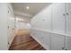 Hallway with wood floor and storage cabinets at 10632 Star Thistle Ct, Highlands Ranch, CO 80126