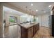 Open kitchen featuring granite counters, stainless appliances, and a view of the backyard at 10632 Star Thistle Ct, Highlands Ranch, CO 80126