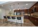 Gourmet kitchen with a large central island, stainless steel appliances, and custom cabinetry at 10632 Star Thistle Ct, Highlands Ranch, CO 80126