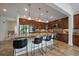 Spacious kitchen boasts an island with seating, granite countertops, and stainless steel appliances at 10632 Star Thistle Ct, Highlands Ranch, CO 80126