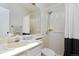 Bathroom featuring a shower-tub combo, white vanity, and a mirror at 690 W Jamison Cir, Littleton, CO 80120