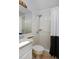 Bathroom featuring a shower-tub combo, white vanity, and a mirror at 690 W Jamison Cir, Littleton, CO 80120