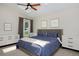 This bedroom features a vaulted ceiling and natural light from the window, creating a calm and inviting space at 690 W Jamison Cir, Littleton, CO 80120