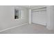 Carpeted bedroom with closet and natural light, providing a comfortable and versatile space at 690 W Jamison Cir, Littleton, CO 80120