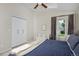 Comfortable bedroom with neutral tones, ample natural light, and a spacious closet for plenty of storage at 690 W Jamison Cir, Littleton, CO 80120