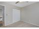 This bedroom features neutral walls and carpet with a closet, creating a tranquil retreat at 690 W Jamison Cir, Littleton, CO 80120