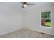 Cozy bedroom with a ceiling fan and lots of natural light from the window at 690 W Jamison Cir, Littleton, CO 80120