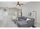Spacious living room with neutral tones, vaulted ceilings, and comfortable seating arrangement at 690 W Jamison Cir, Littleton, CO 80120